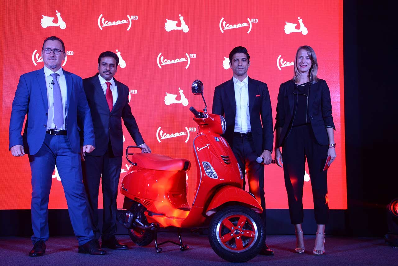 vespa red scooter price with bollywood actor farhan akhtar in india