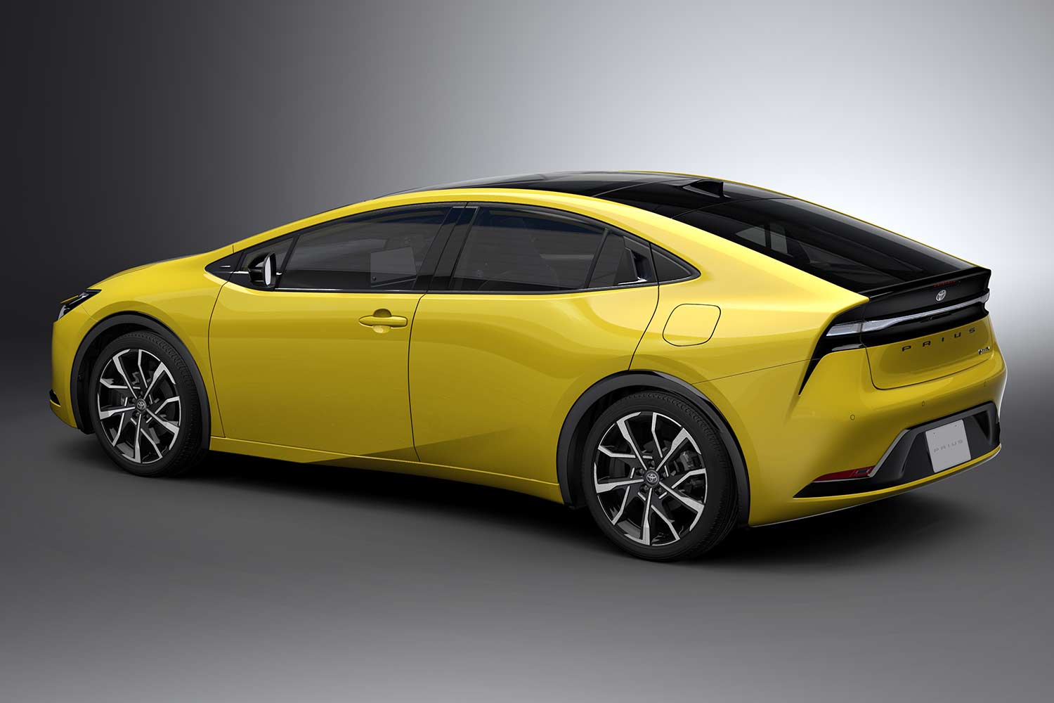 All New 2023 Toyota Prius PHEV Yellow Rear Quarter Left