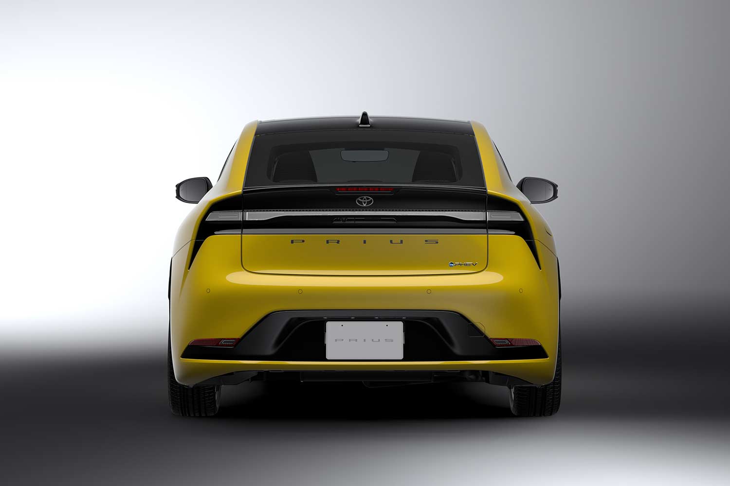 All New 2023 Toyota Prius PHEV Yellow Rear